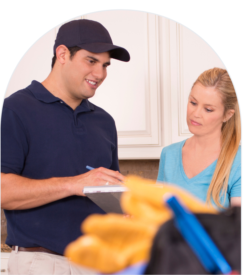 Home services technician speaks with happy customer during on-site appointment